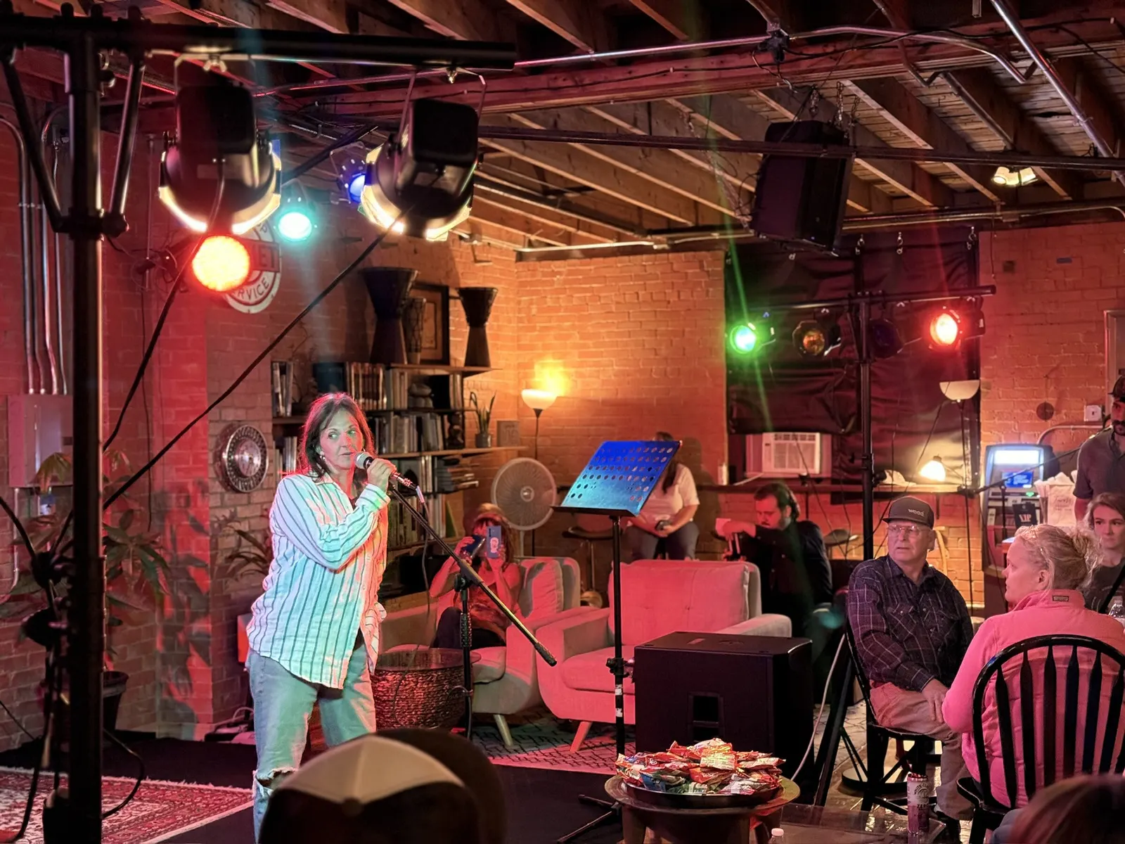 Vocalist under red, green and blue stage lights